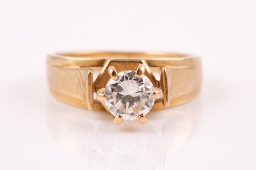Lot 431 - A yellow metal and solitaire diamond ring, set...