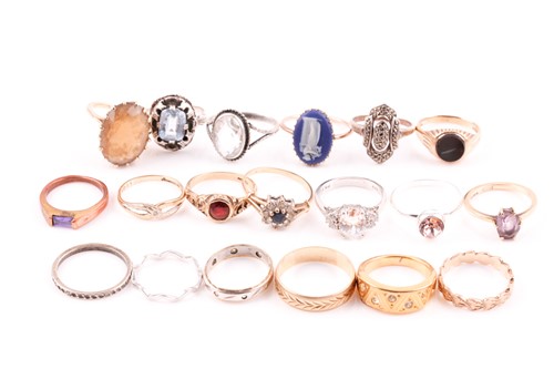 Lot 471 - A collection of nine yellow metal rings of...