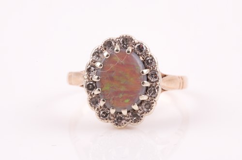 Lot 401 - A 9ct yellow gold, diamond, and opal ring, the...