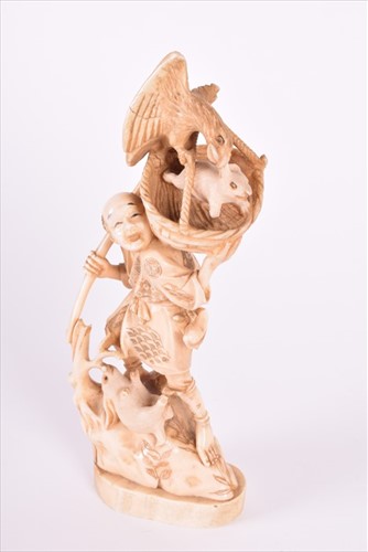 Lot 253 - A Japanese vegetable ivory Okimono of a rabbit...