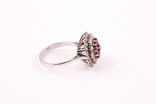 Lot 219 - A white metal diamond and ruby cluster ring,...