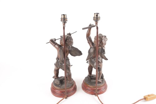Lot 191 - A pair of patinated spelter figural table...
