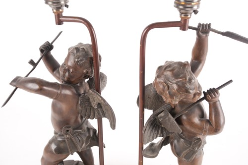 Lot 191 - A pair of patinated spelter figural table...