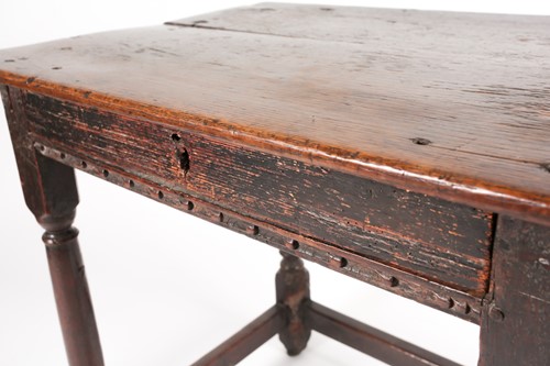 Lot 185 - A late 17th-century oak single drawer side...