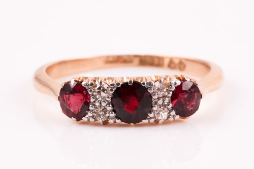 Lot 346 - An 18ct yellow gold, diamond, and ruby ring,...