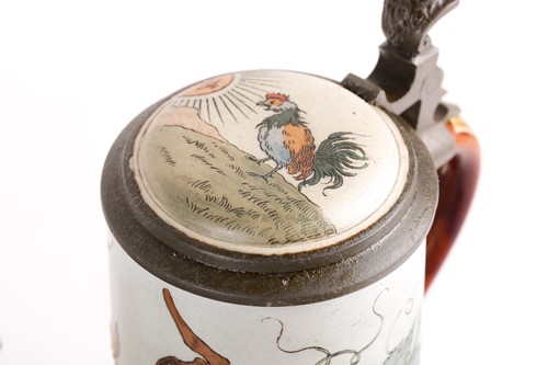 Lot 444 - A Mettlach half litre stein, the lid decorated...