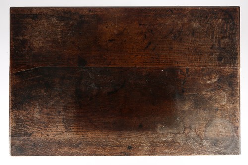 Lot 207 - An early 18th-century oak kneehole lowboy with...