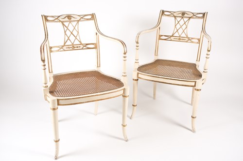 Lot 215 - A pair of Sheraton style ivory painted and...