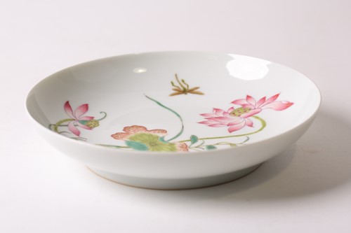 Lot 159 - A Chinese famille rose saucer dish, painted...