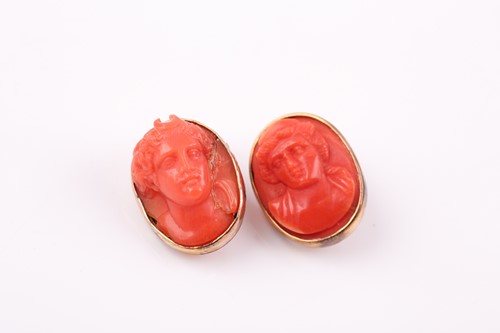 Lot 362 - A pair of late 19th century carved coral cameo...