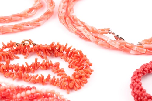 Lot 114 - A gilt metal and triple strand coral bracelet,...