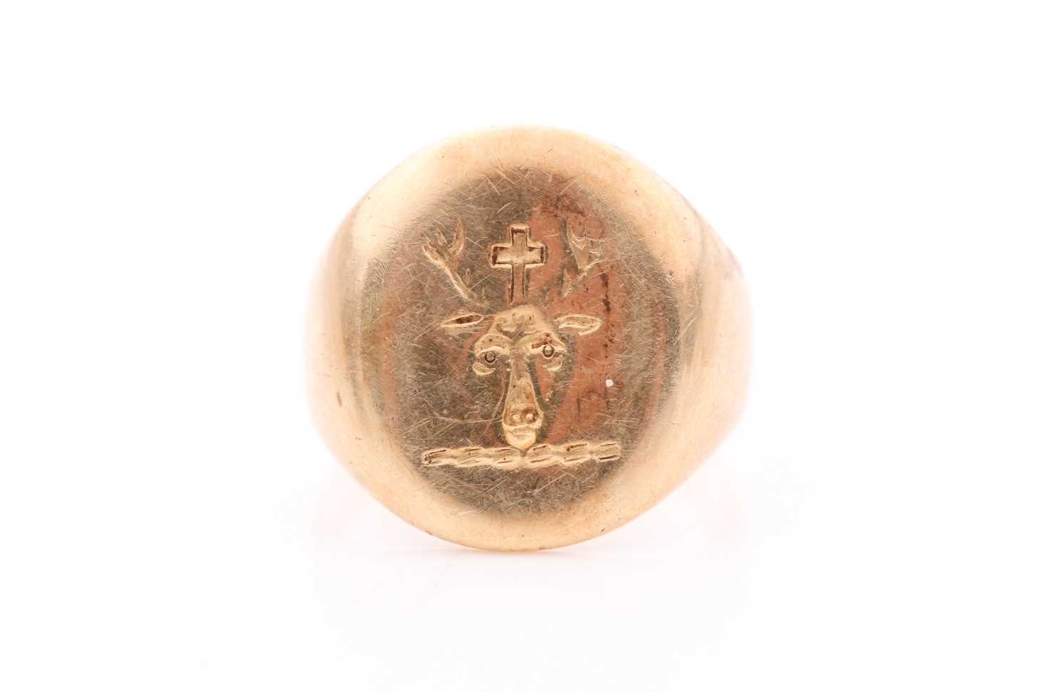 Lot 332 - A yellow metal gents signet ring, worn...