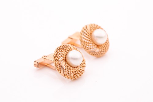 Lot 162 - A pair of yellow metal and pearl cufflinks,...
