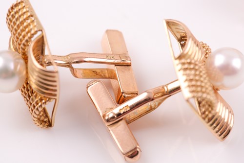 Lot 146 - A pair of yellow metal and pearl cufflinks,...