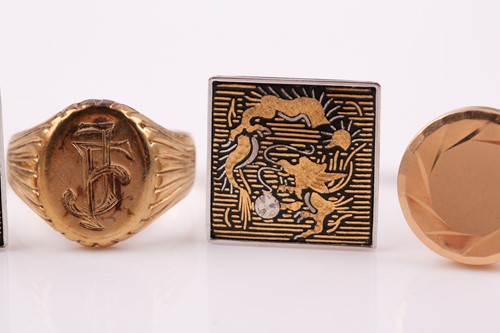 Lot 51 - A yellow metal signet ring, bearing entwined...