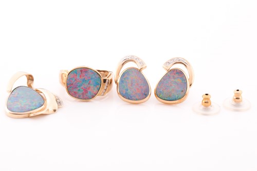 Lot 270 - An opal and diamond pendant, earrings and ring...