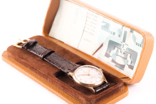 Lot 523 - A gents yellow metal Cyma watch, the round...