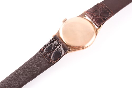 Lot 523 - A gents yellow metal Cyma watch, the round...