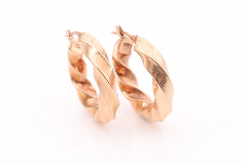 Lot 309 - A pair of 9ct yellow gold hollow twisted hoop...
