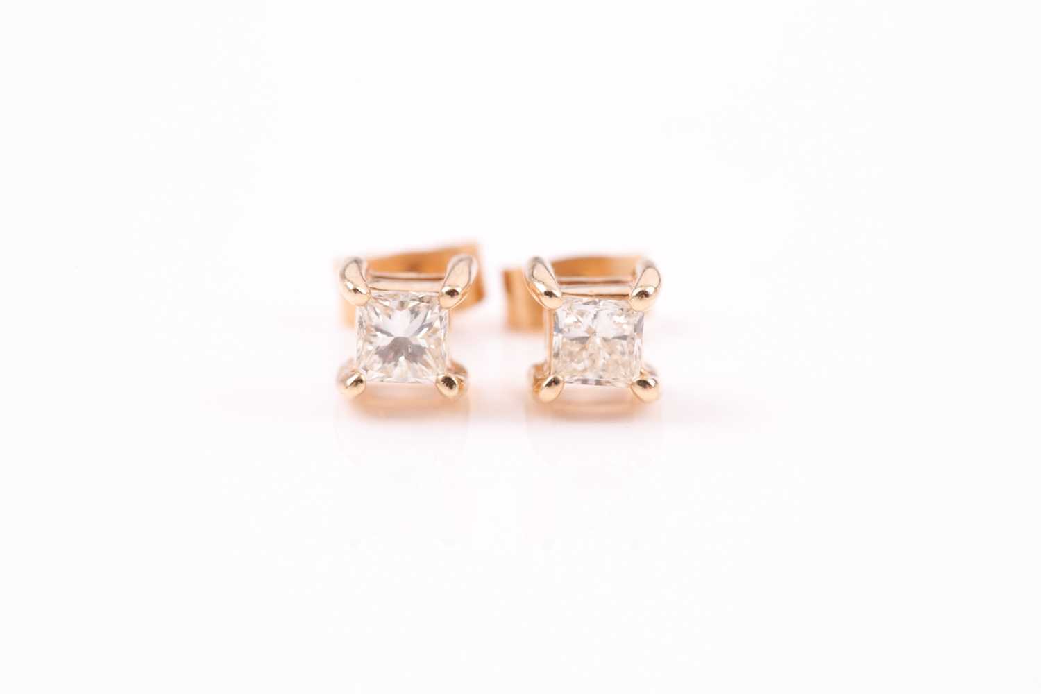 Lot 253 - A pair of yellow metal and diamond earrings,...