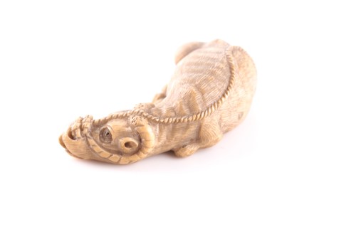Lot 145 - A Japanese carved ivory netsuke in the form of...