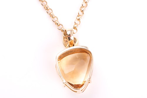 Lot 208 - A yellow metal and citrine pendant, set with a...
