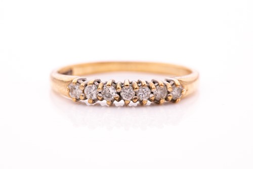 Lot 316 - A 9ct yellow gold and white sapphire ring, set...