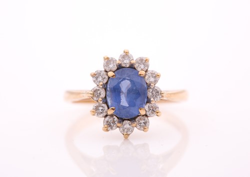 Lot 305 - An 18ct yellow gold, diamond, and sapphire...