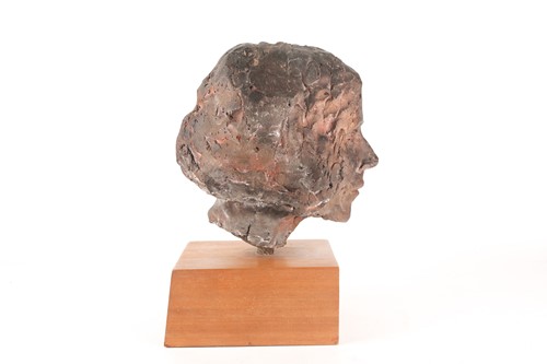 Lot 40 - A stoneware bust of a elderly lady, her hair...