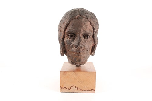 Lot 40 - A stoneware bust of a elderly lady, her hair...