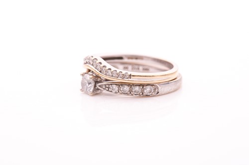 Lot 143 - A 9ct white gold and diamond engagement ring,...