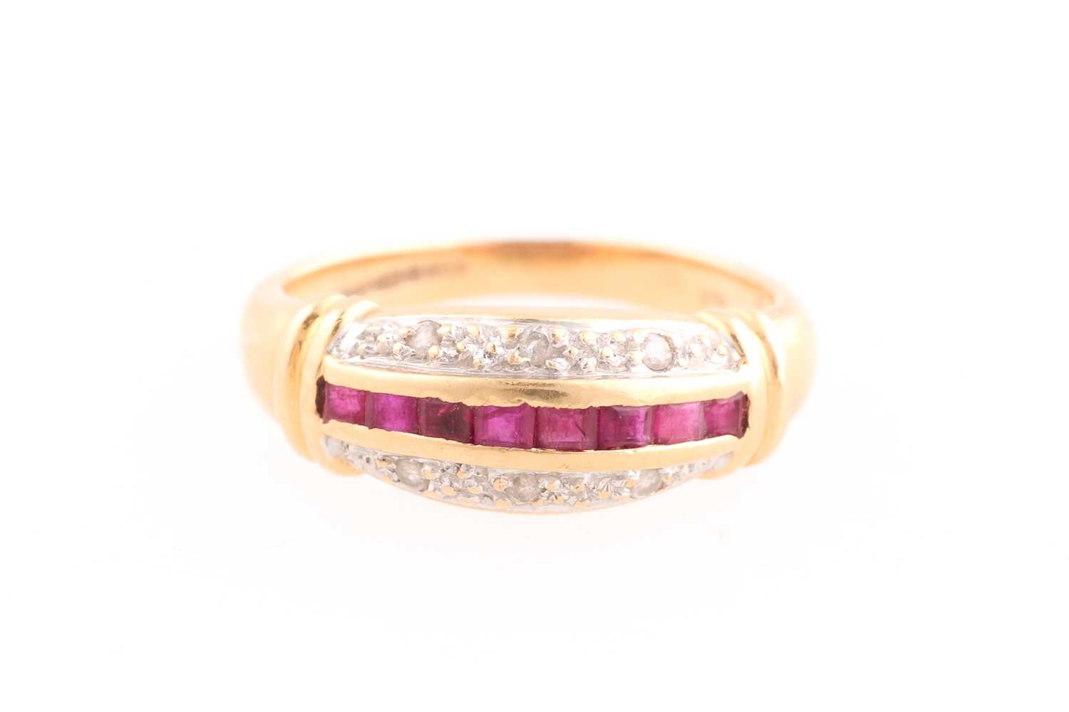 Lot 79 - A ruby and diamond half hoop ring composed of...
