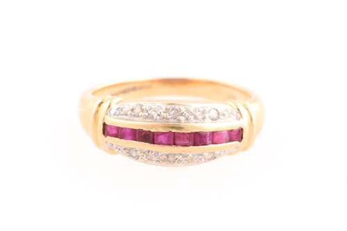 Lot 79 - A ruby and diamond half hoop ring composed of...