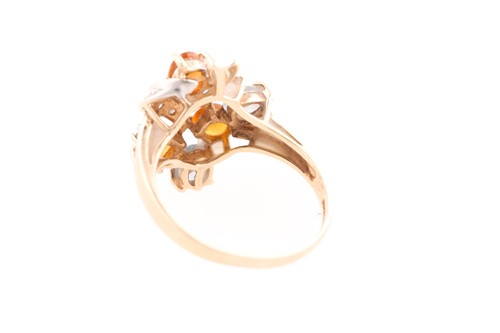 Lot 25 - A 9ct yellow gold, two colour sapphire and...
