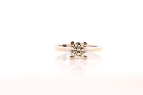 Lot 108 - A single stone diamond ring, the round...