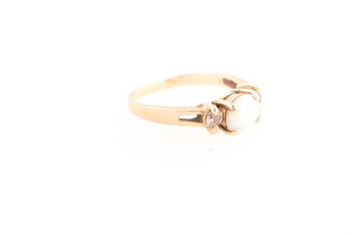 Lot 171 - An opal and diamond three stone half hoop ring;...