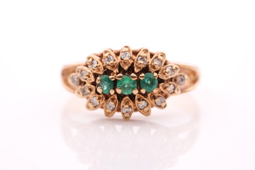 Lot 320 - A yellow metal, diamond, and emerald ring, set...