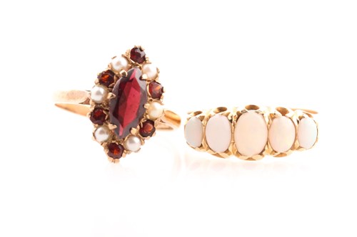 Lot 19 - A graduated five stone opal half hoop ring; in...