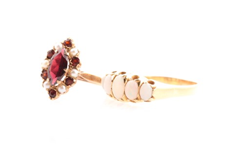 Lot 19 - A graduated five stone opal half hoop ring; in...