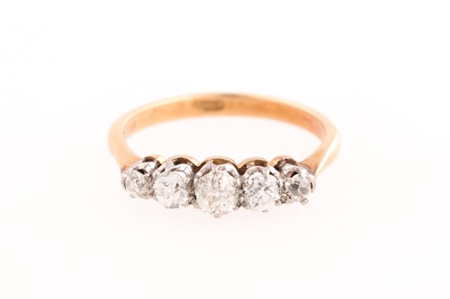 Lot 360 - A five stone diamond half hoop ring; the...