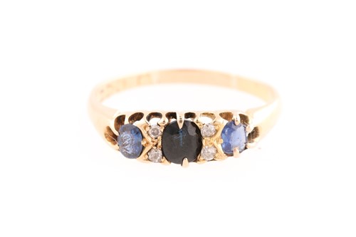 Lot 285 - An Edwardian sapphire and diamond half hoop...