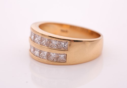 Lot 70 - A yellow metal and diamond ring, the band...