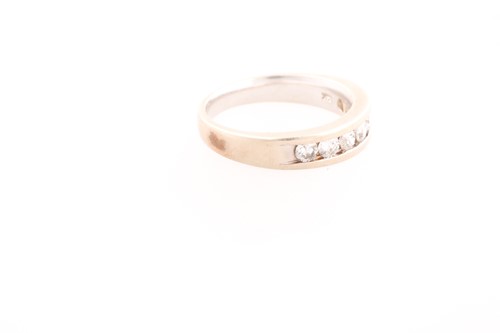 Lot 248 - A seven stone half hoop diamond ring, the...