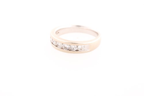 Lot 248 - A seven stone half hoop diamond ring, the...