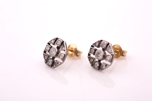 Lot 76 - A pair of diamond earrings, the openwork...