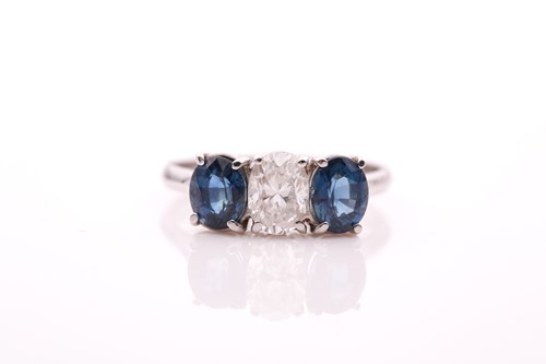 Lot 190 - A diamond and sapphire ring, set with a mixed...