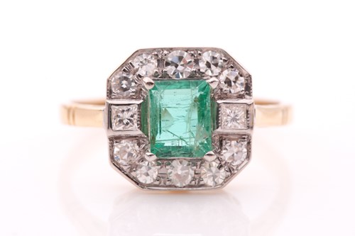 Lot 311 - An 18ct yellow gold, diamond, and emerald ring,...
