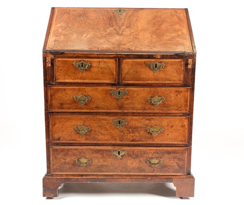 Lot 78 - A George I style figured walnut fall front...