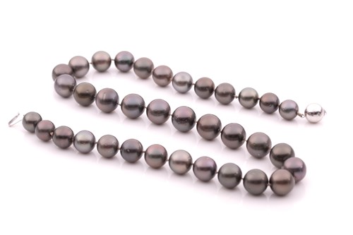 Lot 141 - A Tahitian grey pearl necklace, the pearls...