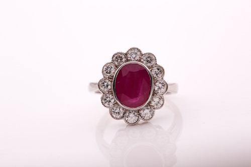Lot 321 - An 18ct white gold, diamond, and ruby cluster...